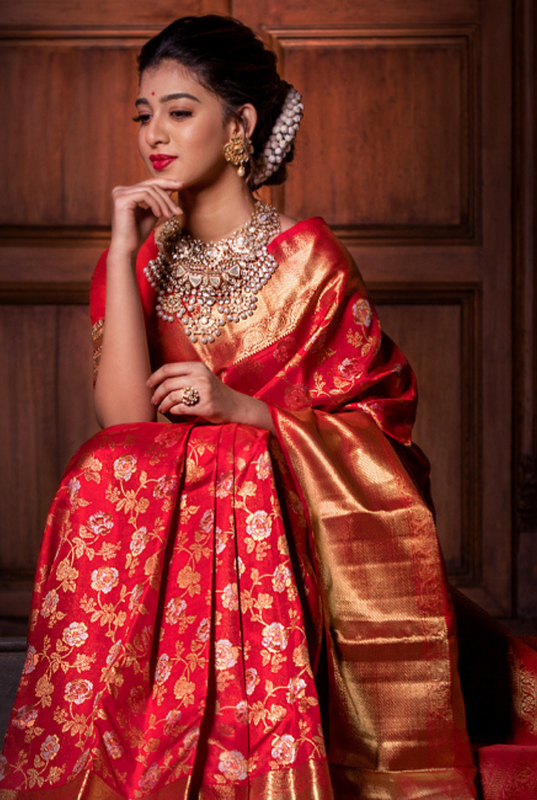 A Scarlet Symphony Unveiling the Enduring Charm of Red Kanjivaram Silk Saree in a Bridal Trousseau Bridal Kanjivaram Sarees Patterns and Motifs and more Pashudh Sarees Silken Symphonies blog