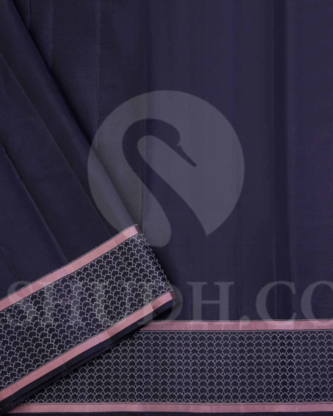 Youthful & Fresh, this Stunning Kanjivaram Silk Saree is out of the ordinary. The pleasing light grey body is adorned with white flowers and dark grey leaves, giving a soft feel, reminding one of japanese art. The complimenting charcoal grey border and pallu features an attractive satin finish and is adorned with a contemporary geometric pattern woven with gold silver zari. The charcoal grey blouse with matching border looks stunning with the light grey, giving a uber cool look in a Saree.